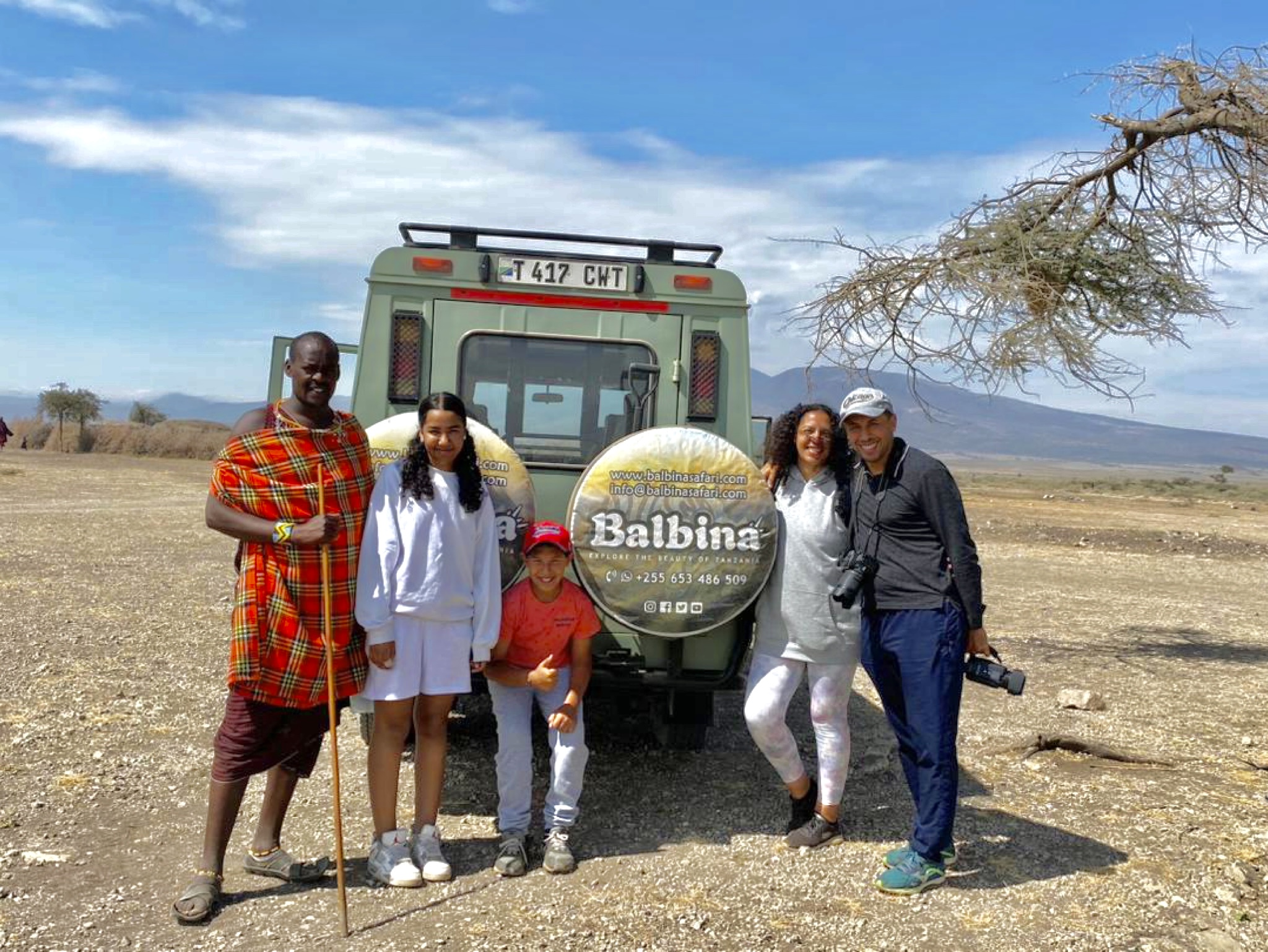 A family enjoying a safari game drive together